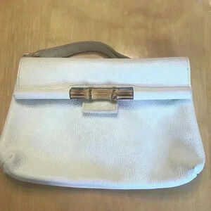 Cecconi Piero white clutch bag.
